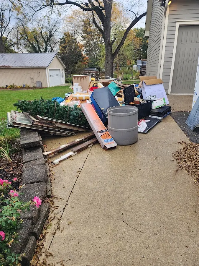 Dumpster being loaded with debris for 3 Yard Dumpster Rental in New Carrollton